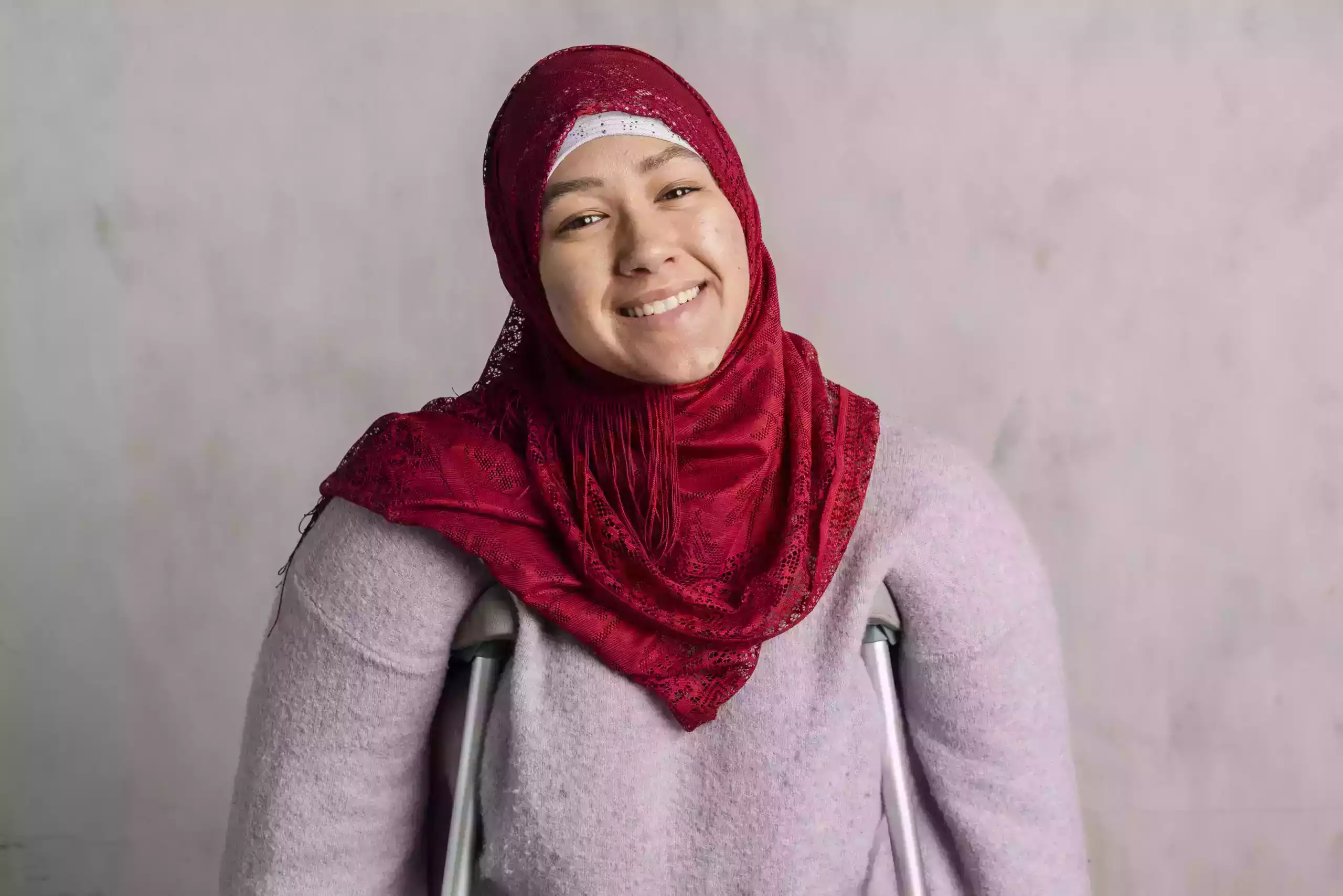happy-muslim-woman-with-crutches-2022-12-16-00-02-40-utc-scaled (2) (2)